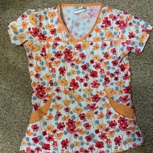 Floral orange/peach scrub top